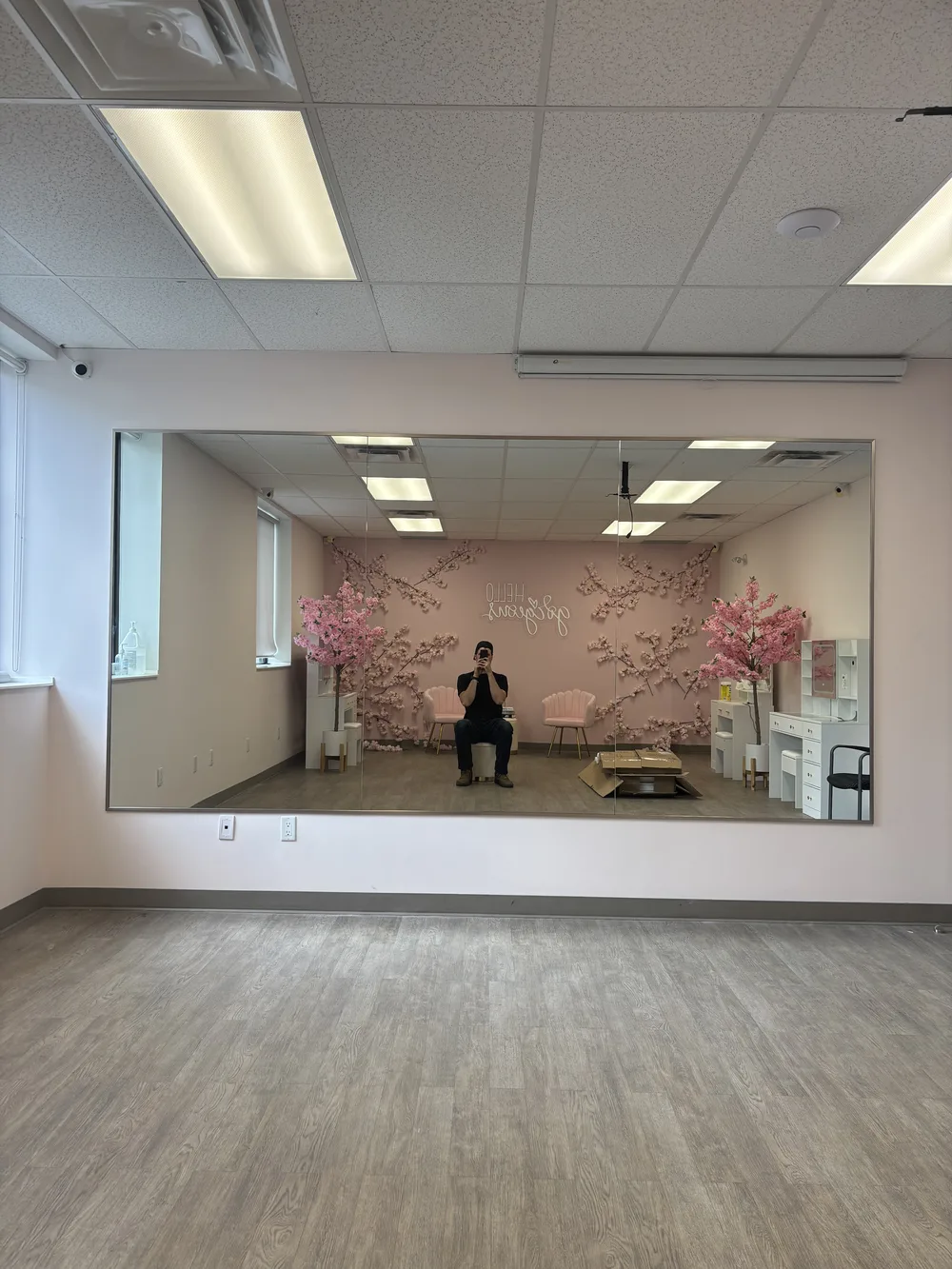 Full-height custom gym mirror wall in a physical therapy clinic or fitness studio