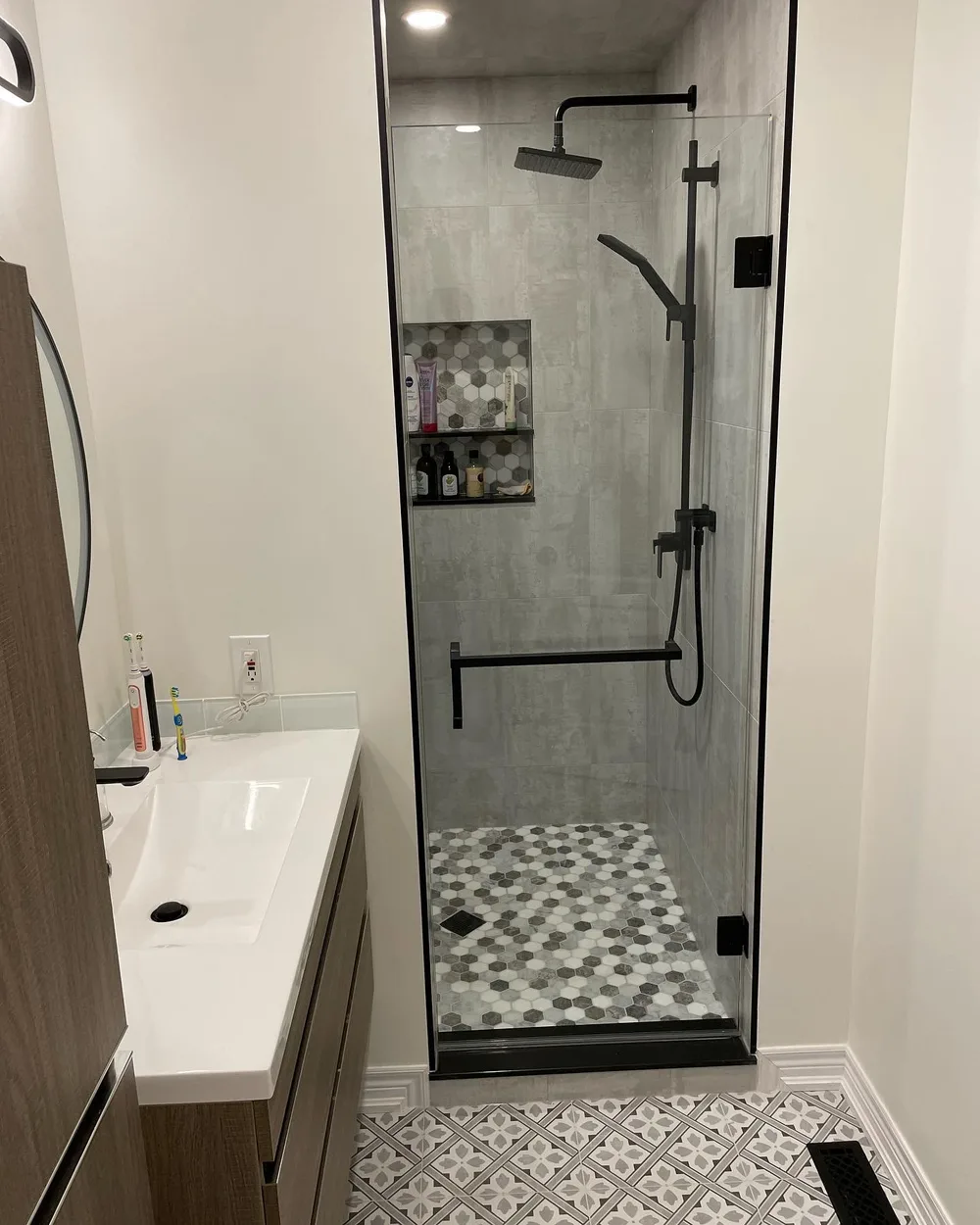 Glass shower door with matte black hardware